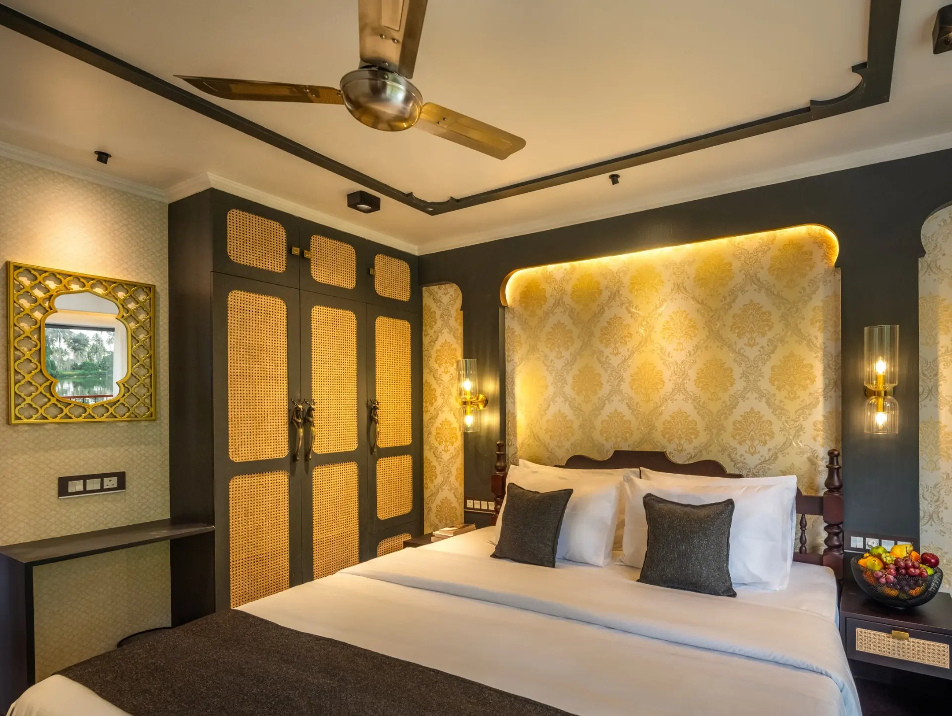 Colonial Suite luxury Kerala houseboat bedroom with dark wood interiors